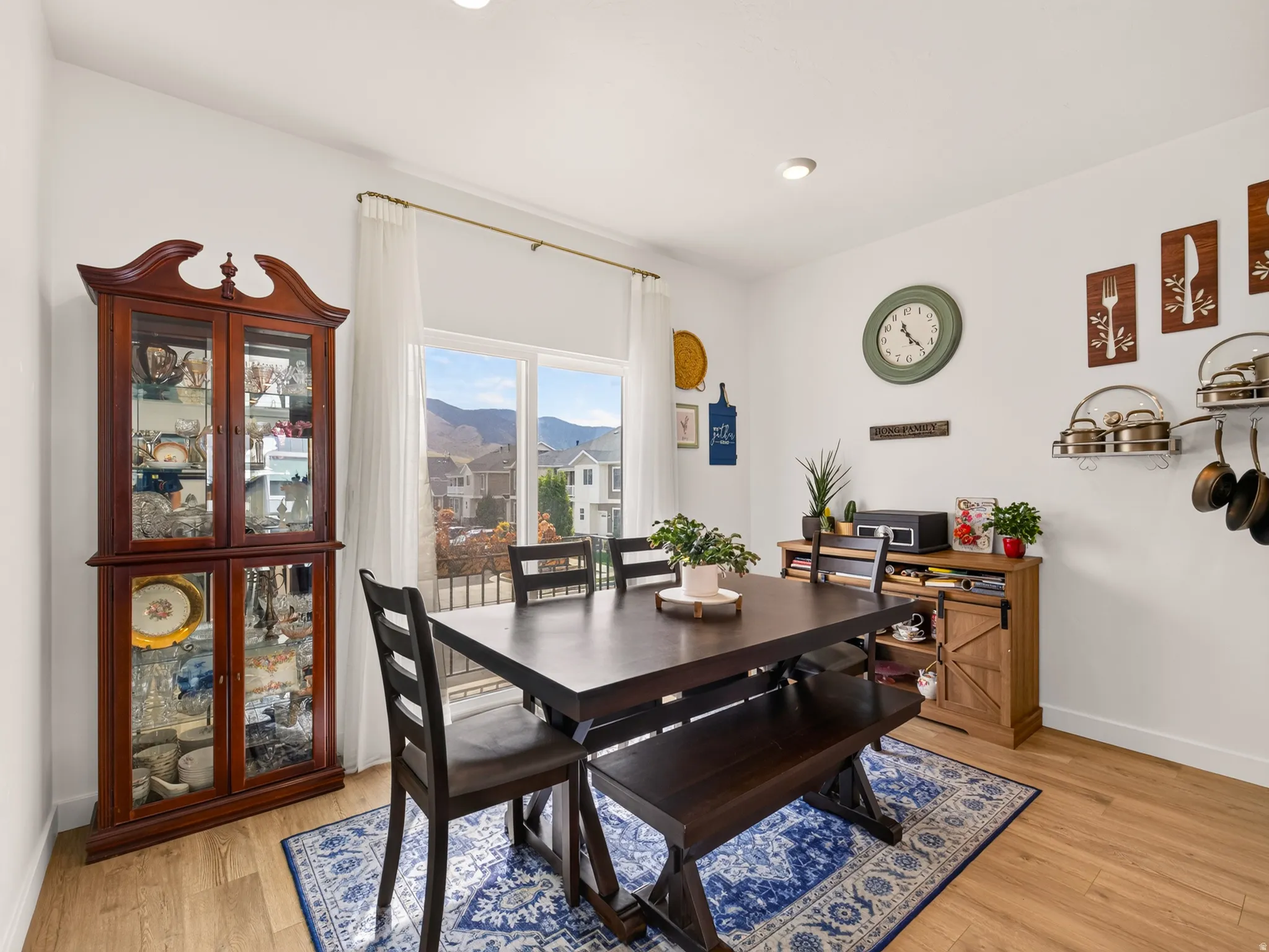 Recessed ceiling lighting illuminates wood-finish flooring