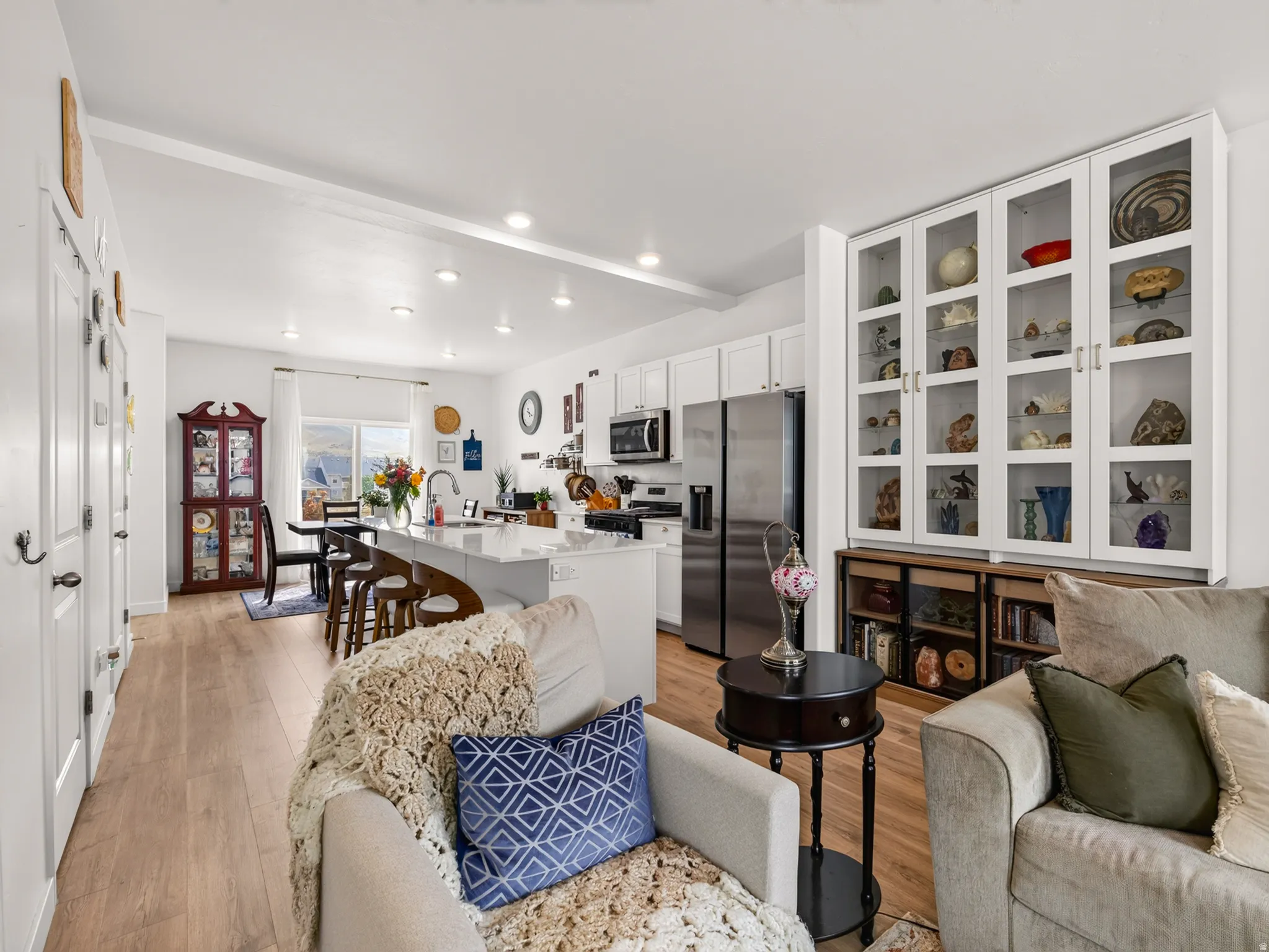 Open-concept living area with wood-finish flooring
