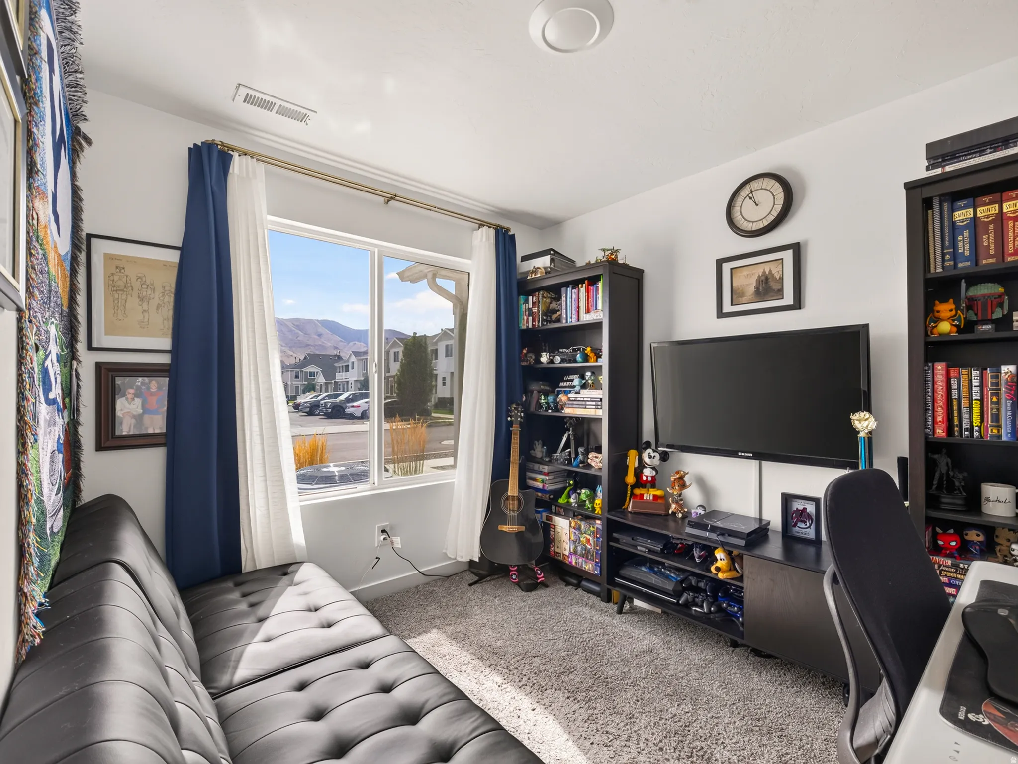 Recessed ceiling lighting, large window with ample natural light, soft carpet flooring, and white painted walls