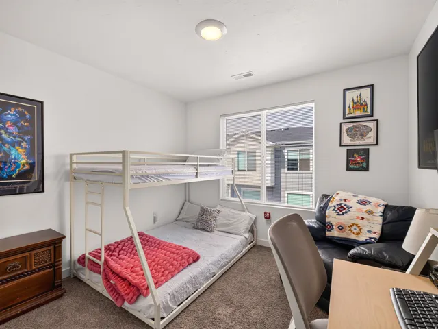 White walls and light-colored carpet provide a neutral palette