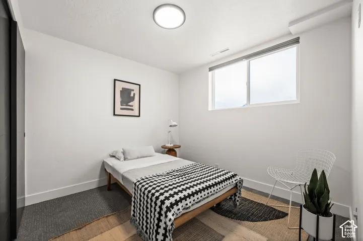 Bright room with white walls, a recessed window, and flush-mount ceiling lighting