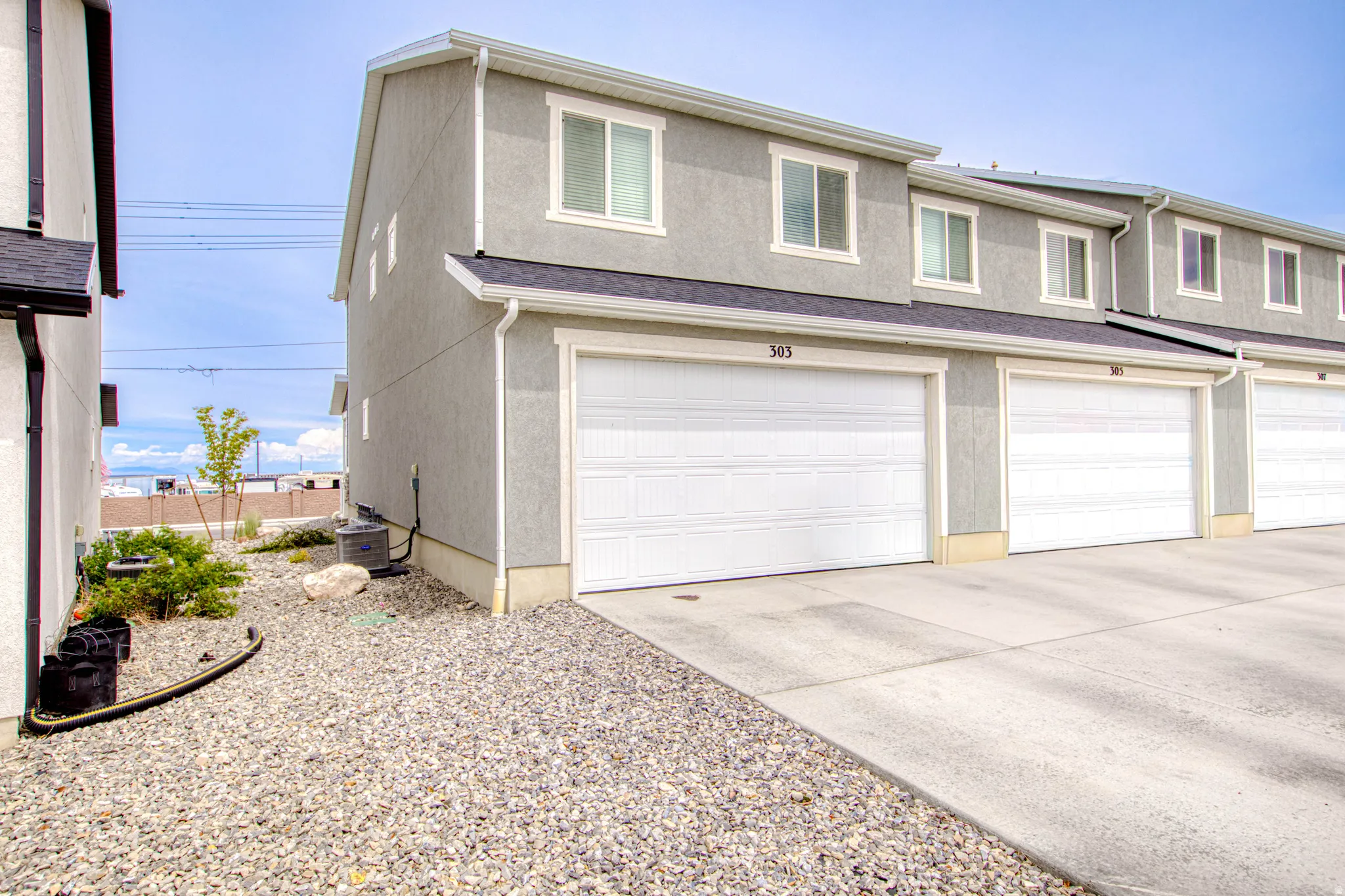 Attached garage with white panel doors