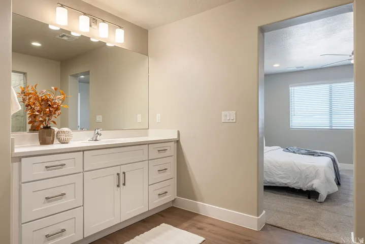 Bathroom vanity with a single basin, ample countertop space, and under-sink storage