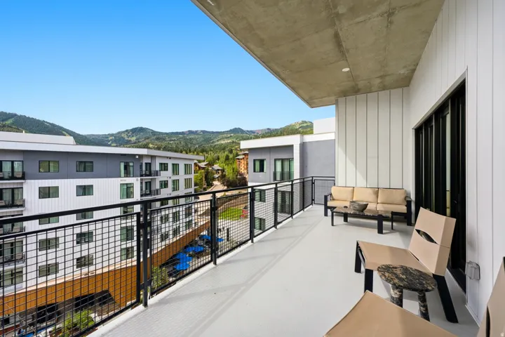 Spacious balcony with concrete flooring and a concrete ceiling