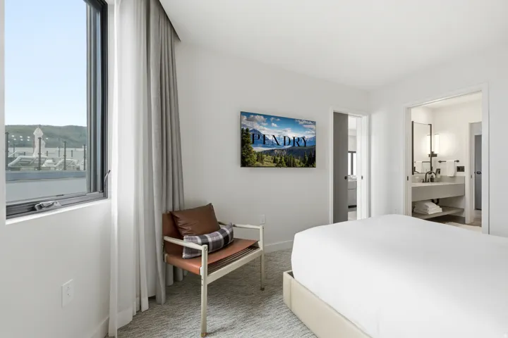 Wall-mounted display, window with roller shade, and broadloom carpet
