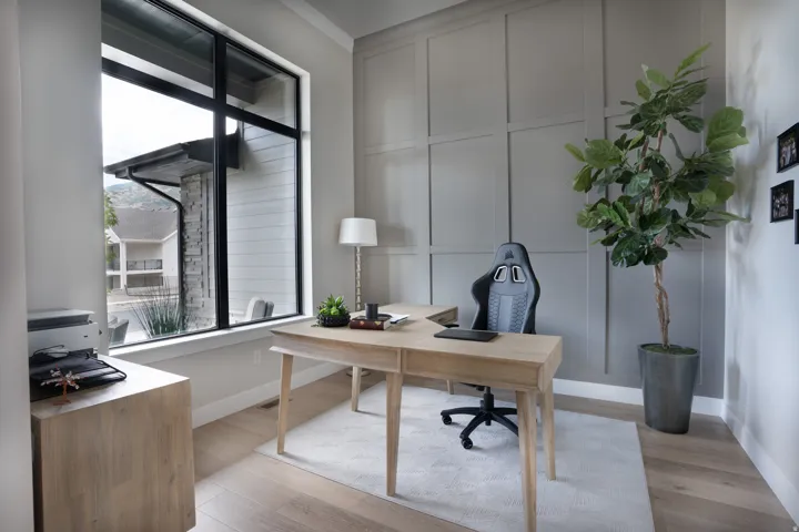 Expansive window with black trim, light wood-finish flooring, accent wall with panel molding, and crisp white baseboards