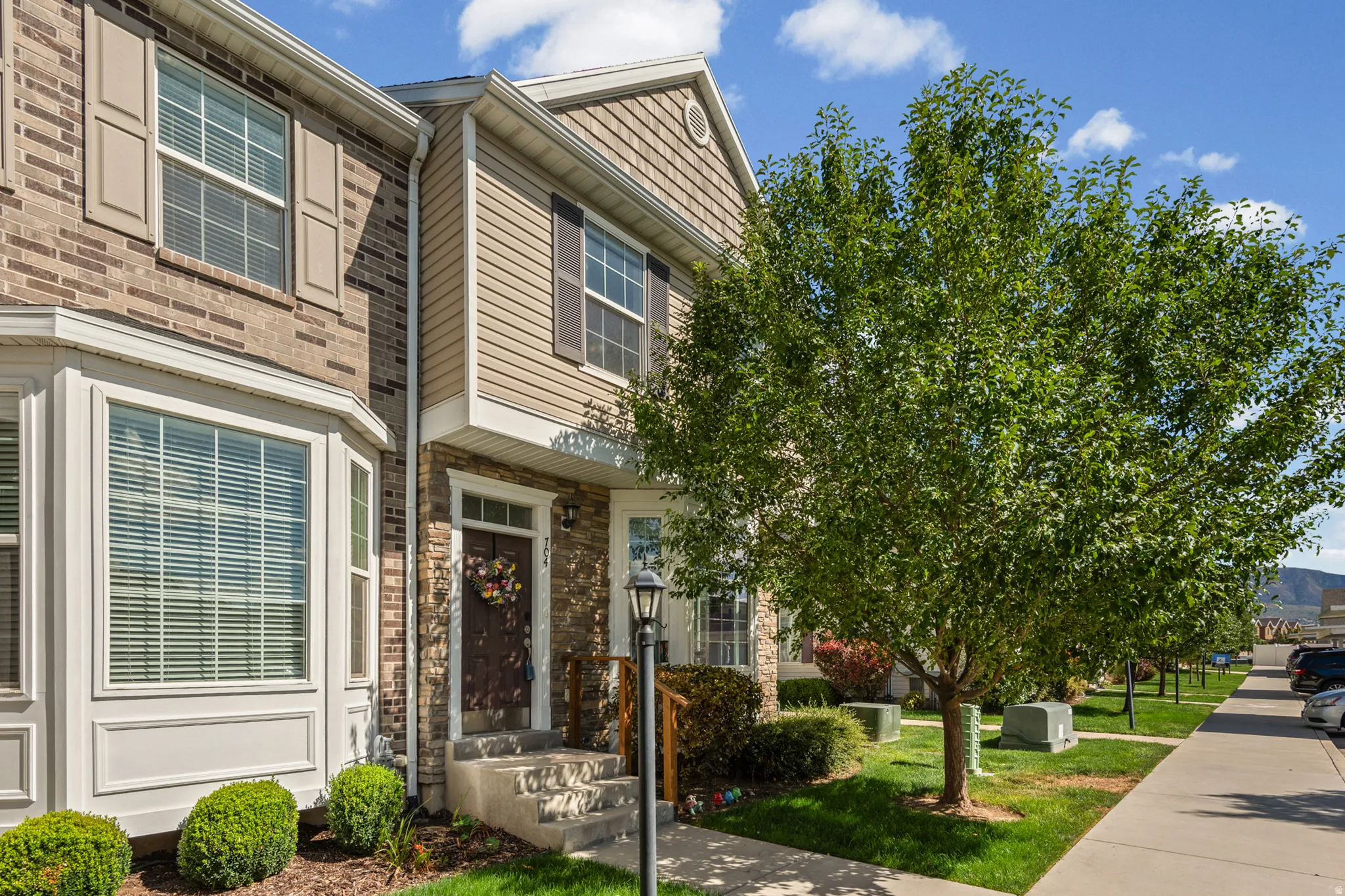 Brick and siding exterior with decorative shutters