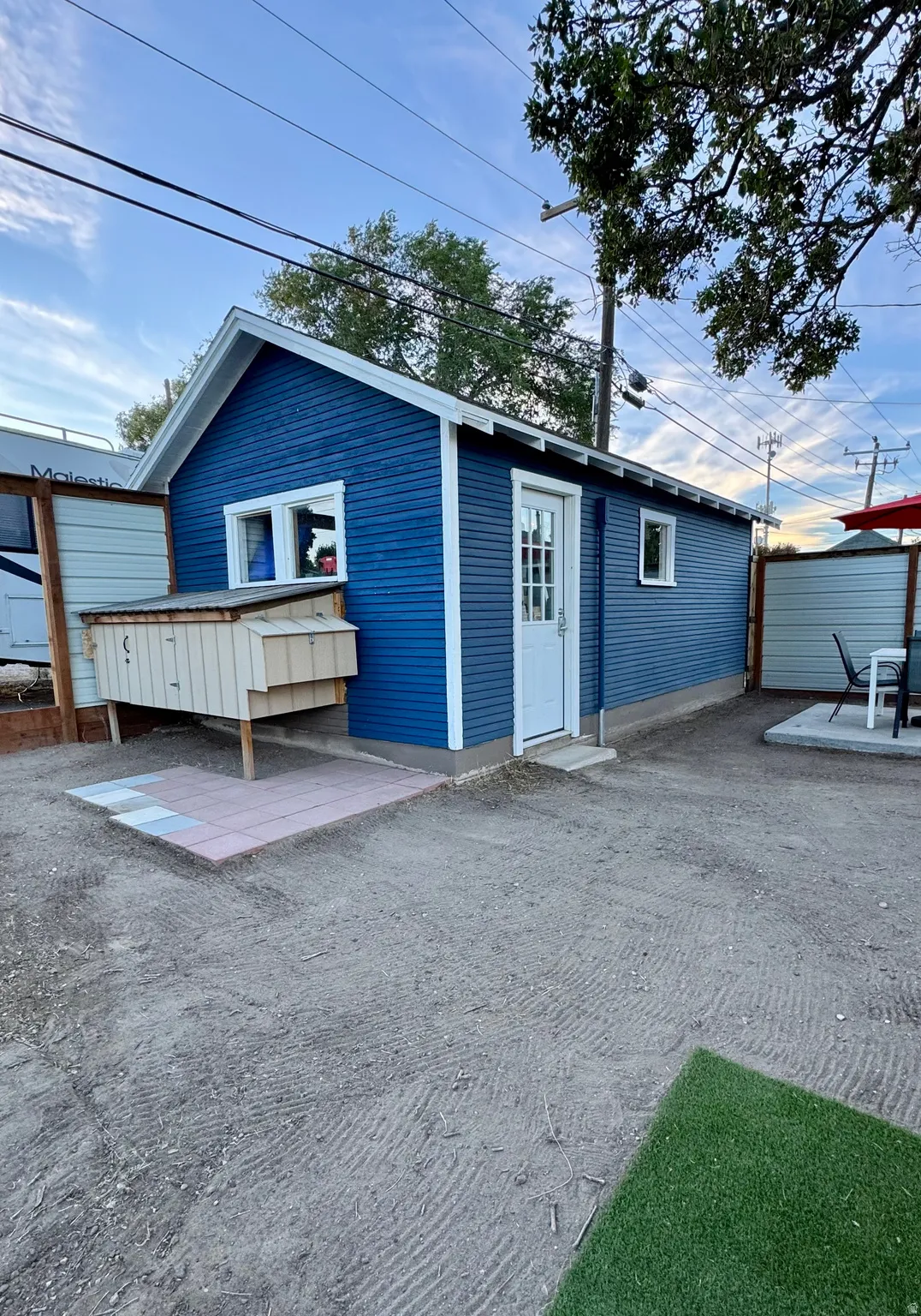 Chicken coop next to garage/workshop.