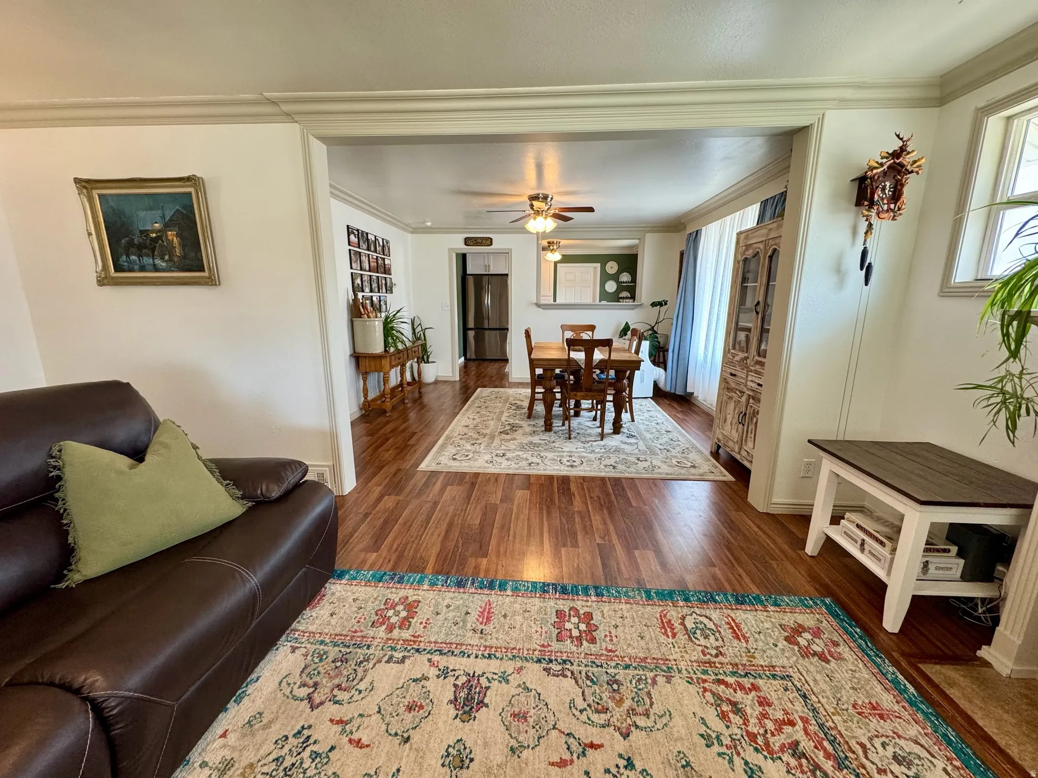Wood-finish flooring extends through multiple rooms