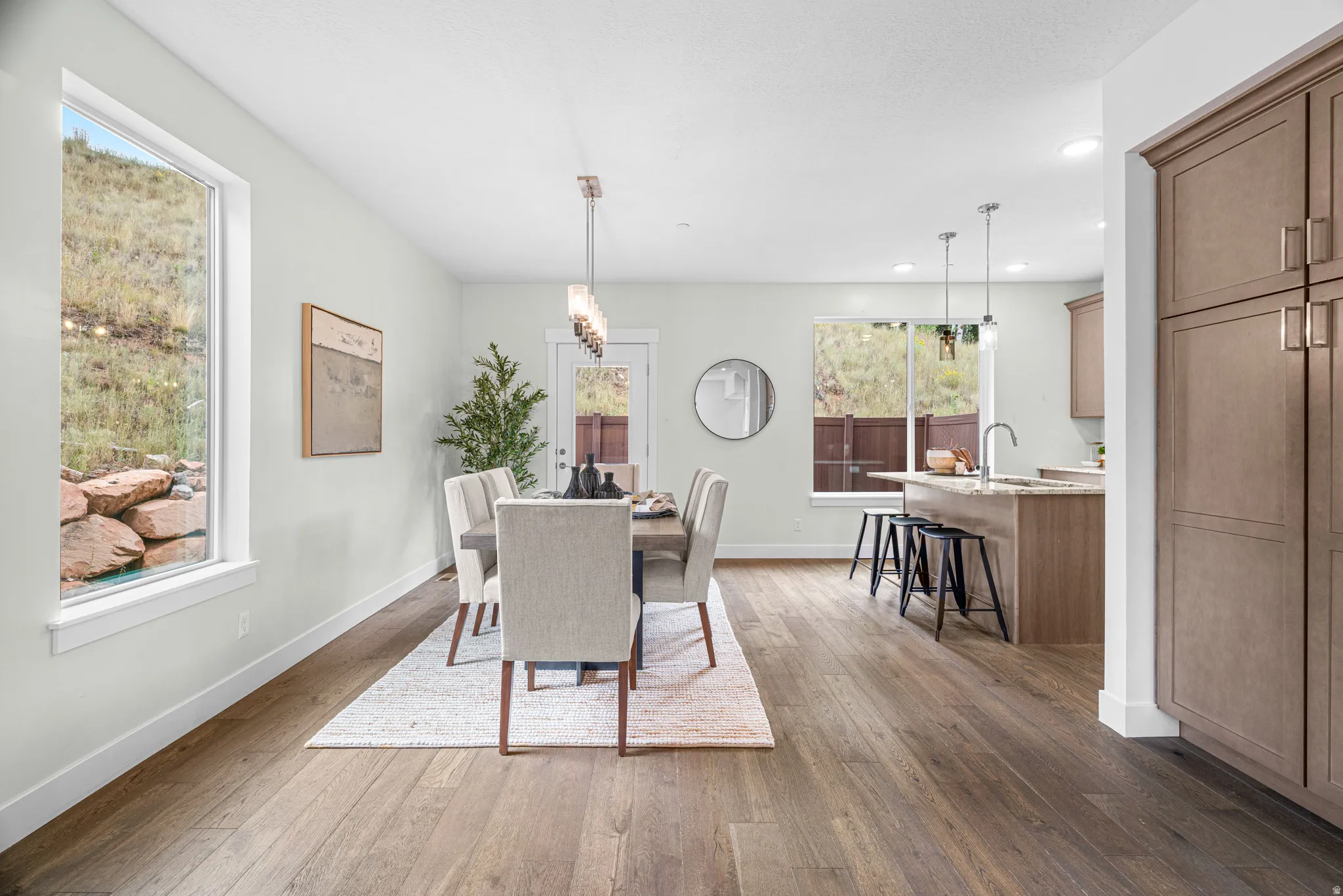 Open-concept living space with wood-finish flooring