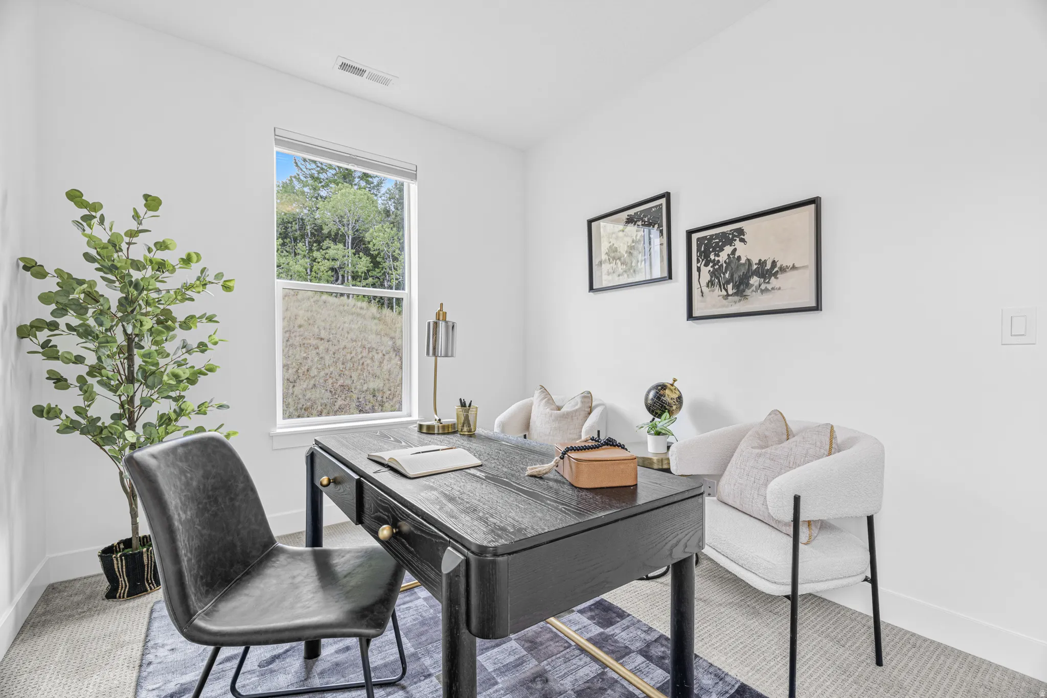 White walls and ceiling paired with light gray carpeting