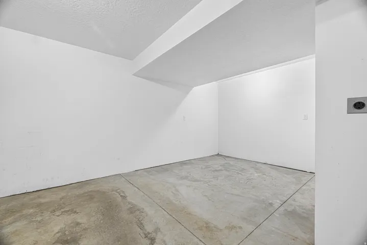 Concrete flooring with white painted walls