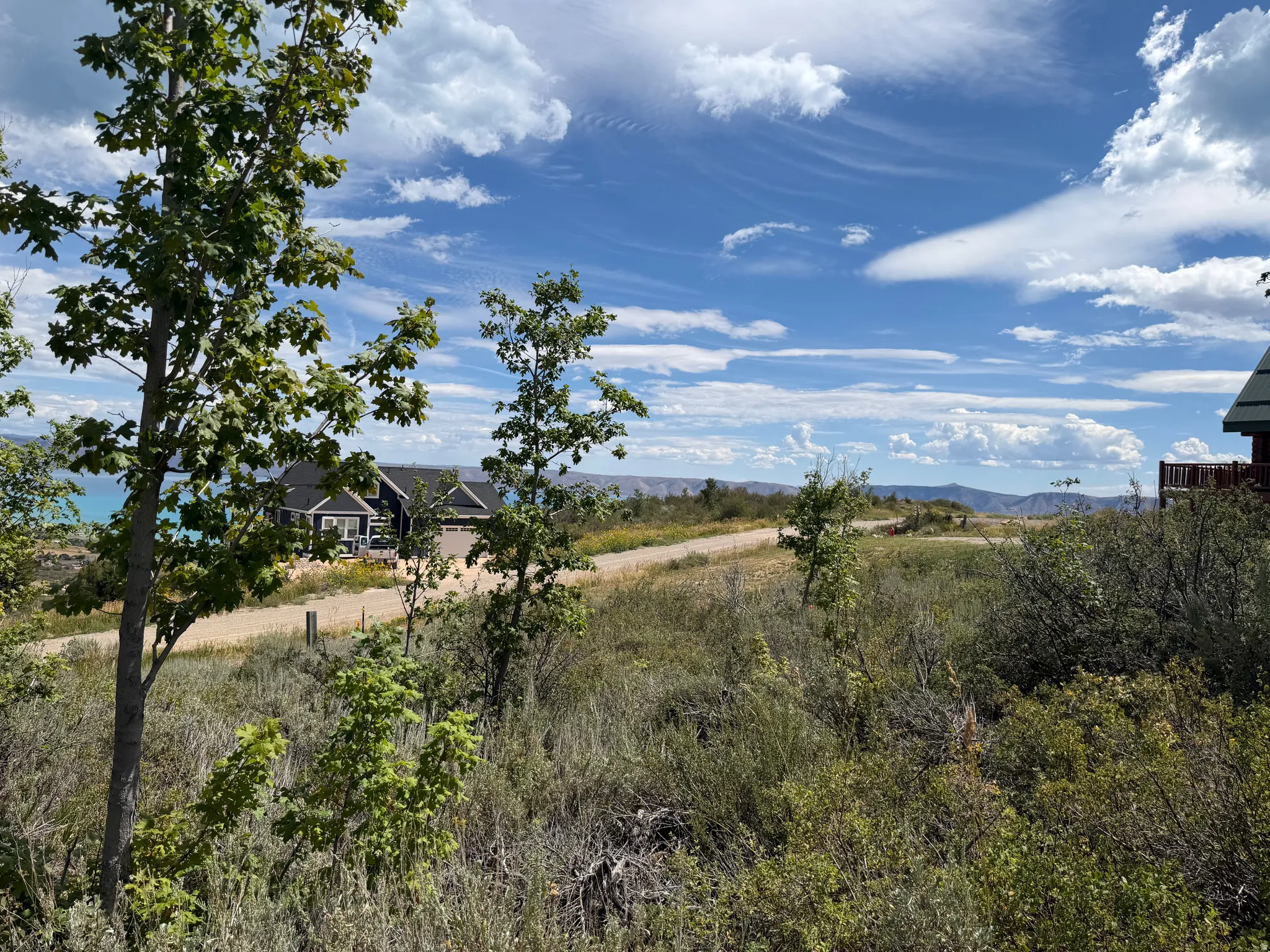Expansive natural landscape with varied terrain and distant water