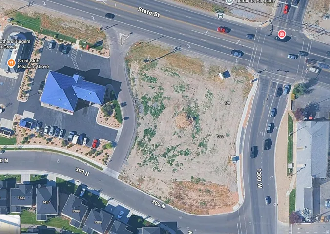 Aerial Site Plan. Overview of a commercial parcel at the intersection of State St and 1300 W, depicting adjacent properties and road infrastructure
