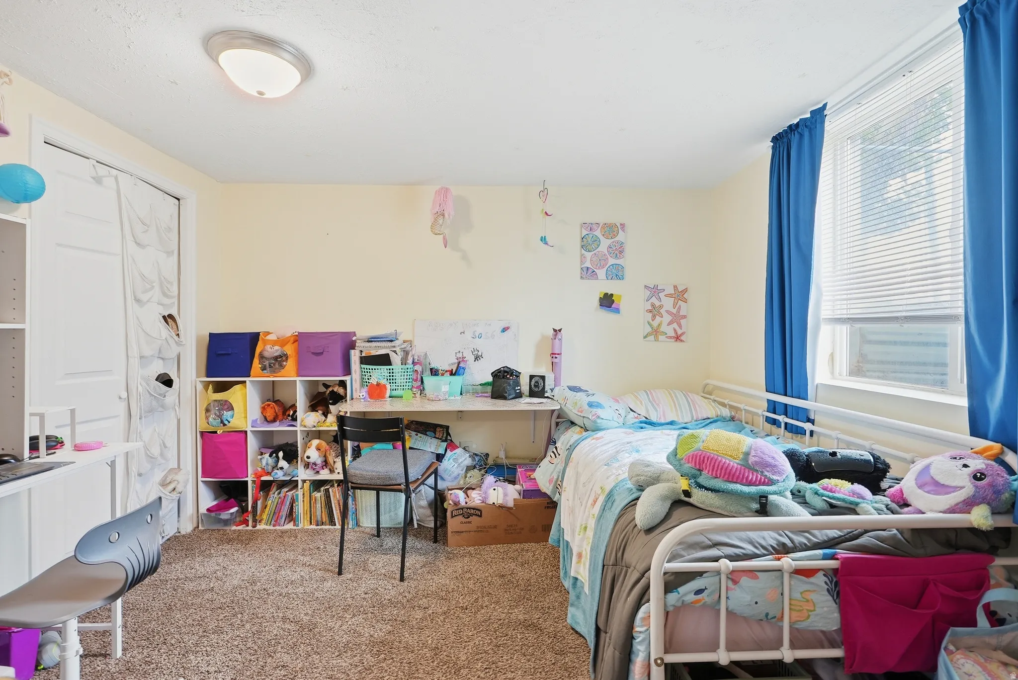 Neutral-toned walls complement the carpeted flooring