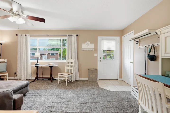 Entryway with tiled flooring and a single window door
