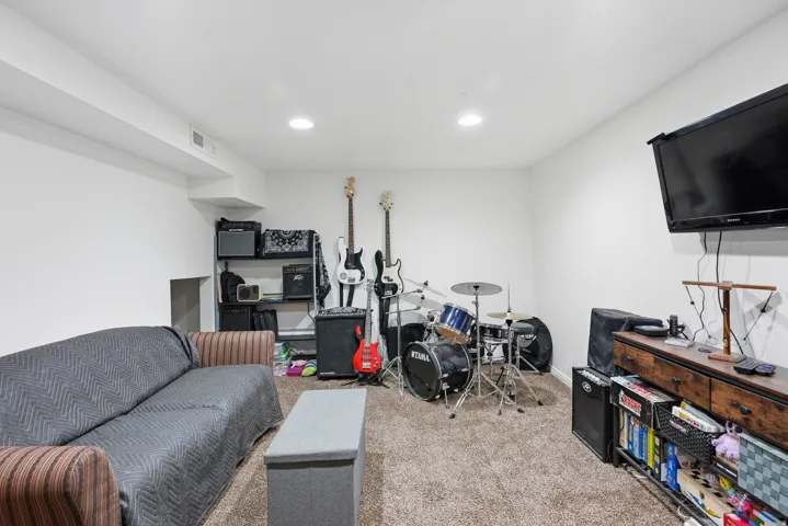 Recessed lighting, carpeted flooring, and white walls