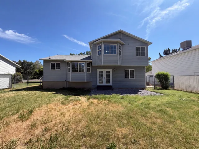Two-story exterior with light gray siding