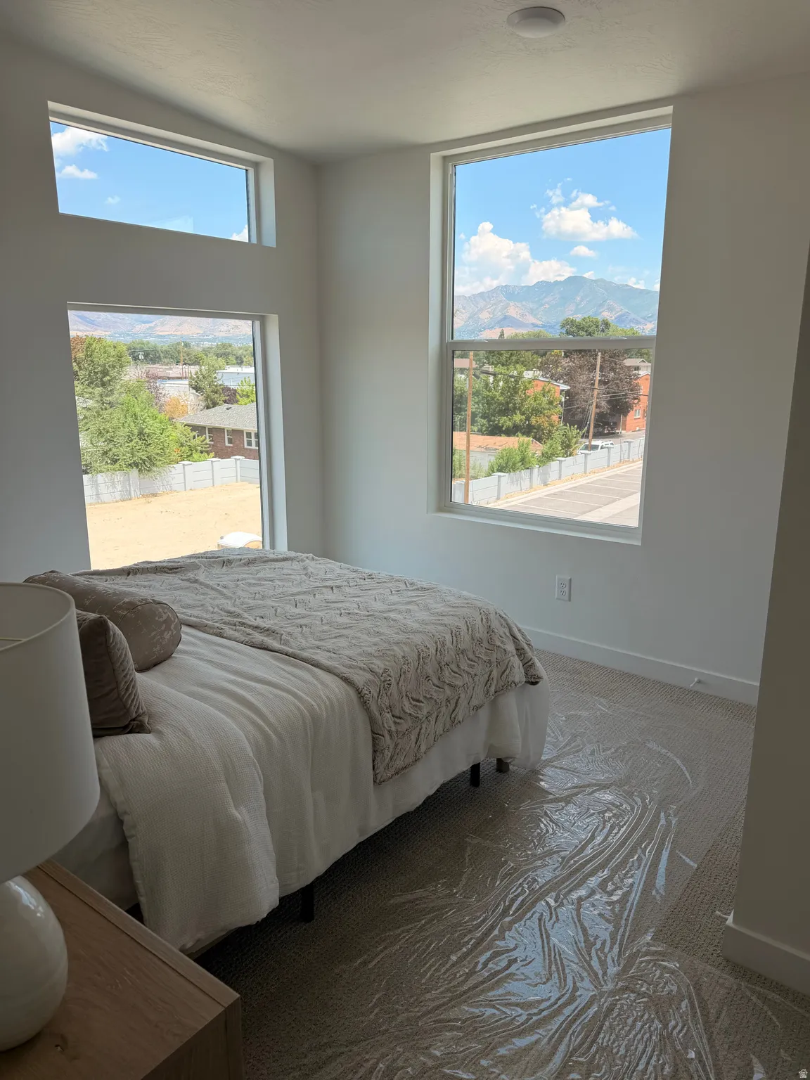 White walls with multiple windows, including transom windows