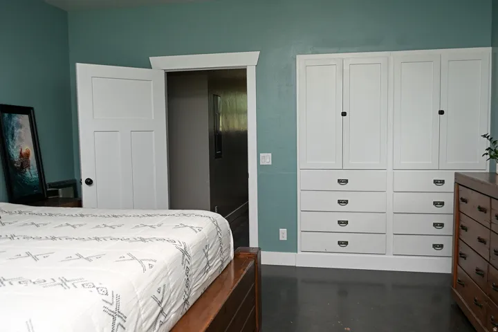 Built-in cabinetry with paneled doors and drawer storage