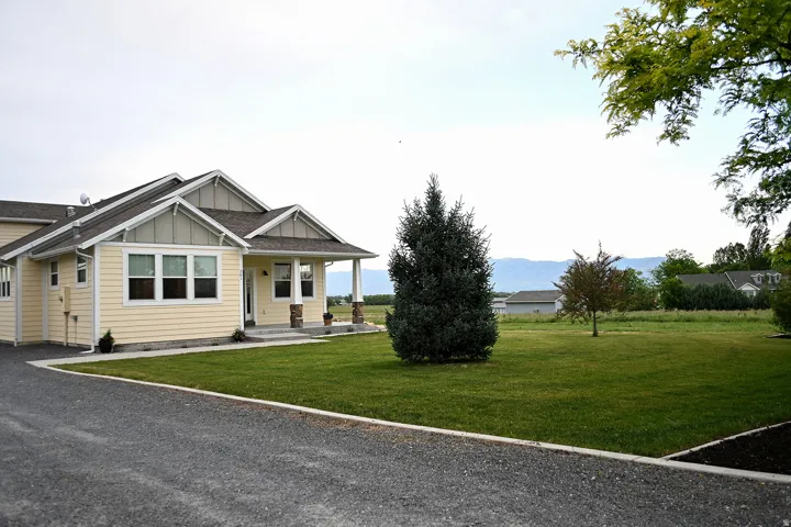 Gabled rooflines with light-colored siding