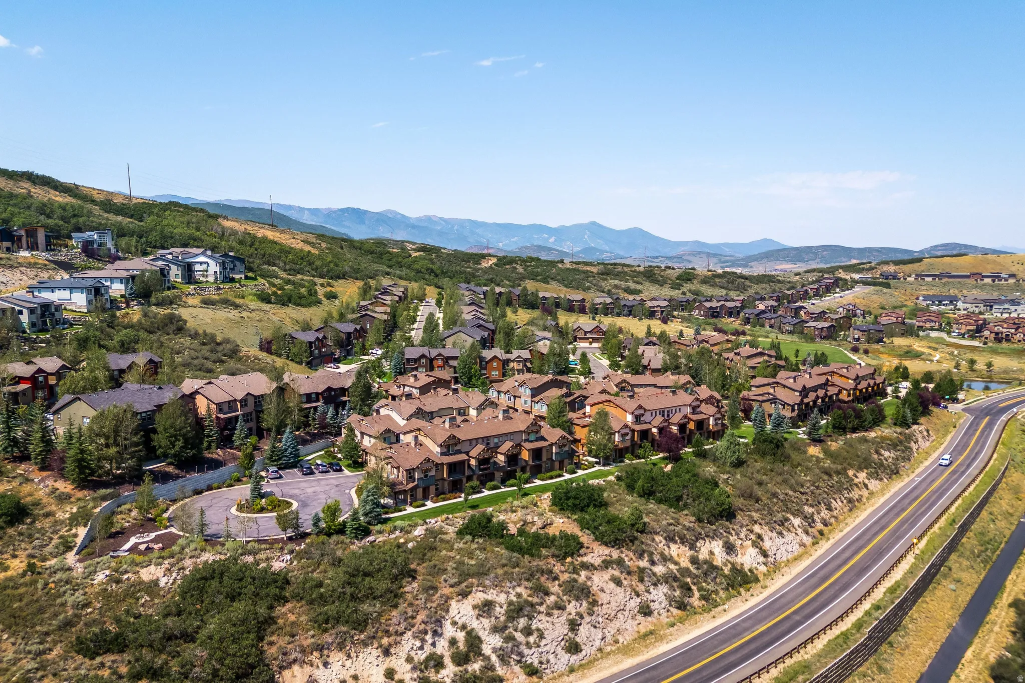 Residential community with varied architectural styles set on rolling hillsides
