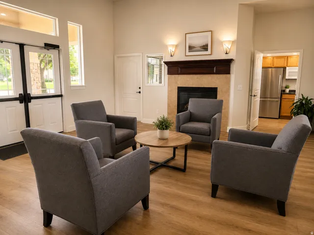 Gathering Area in the Club House featuring a gas log fireplace.