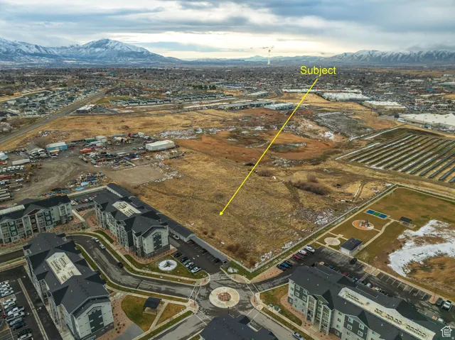 Expansive undeveloped land parcel with mountain backdrop