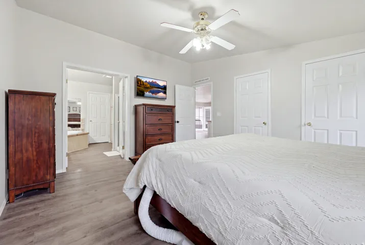 Wood-finish flooring with light gray wall tones