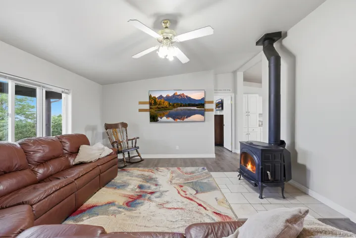Hardwood-finish flooring, recessed lighting, and a ceiling fan