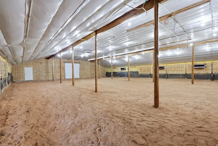 Spacious interior with exposed wooden support beams