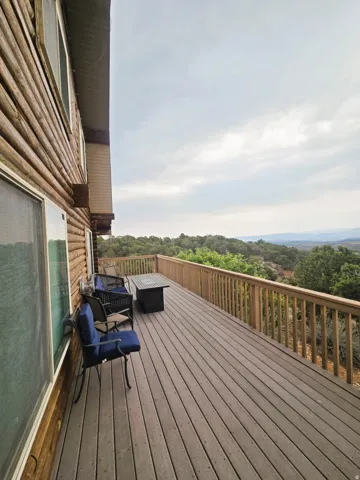 Expansive deck with wood-finish decking and wooden railing