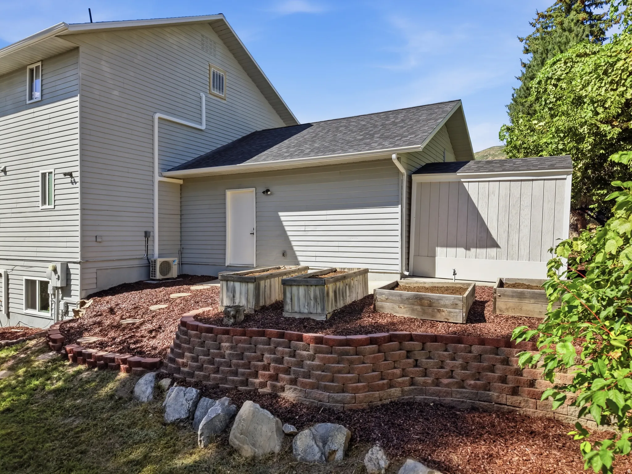 Backyard with terraced retaining wall and garden area