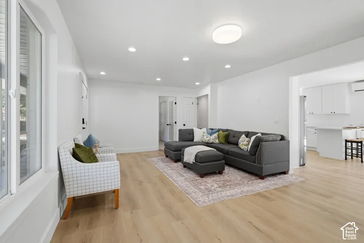 Bright interior with wood-finish flooring, and recessed lighting