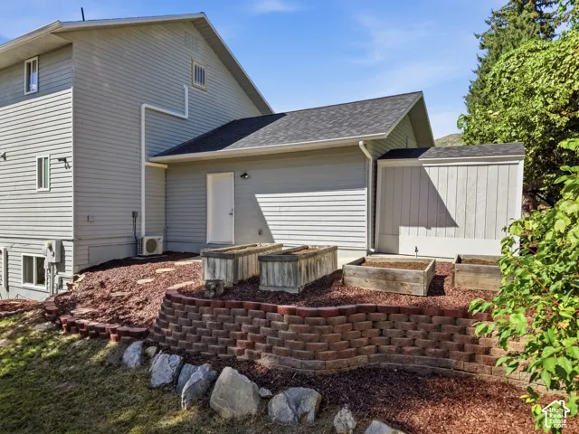 Backyard with terraced retaining wall and garden area