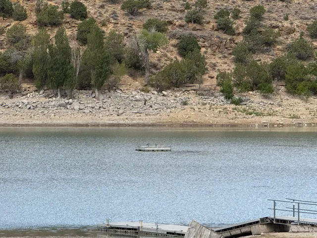 Waterfront access featuring a floating dock and a boat ramp