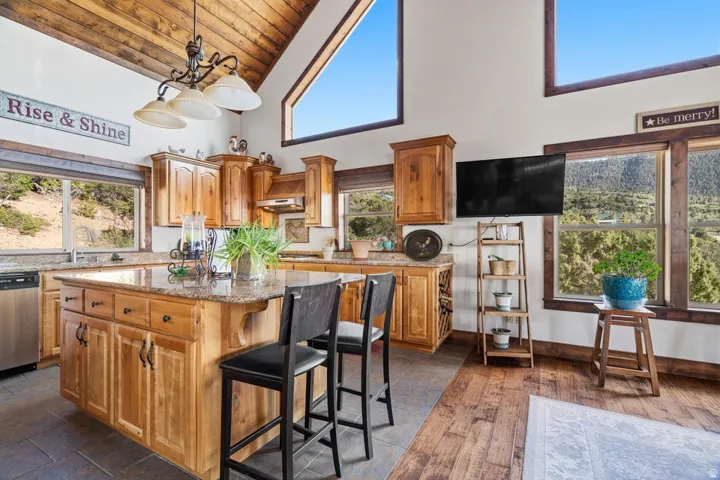 Vaulted wood-finish ceilings and exposed beam accents