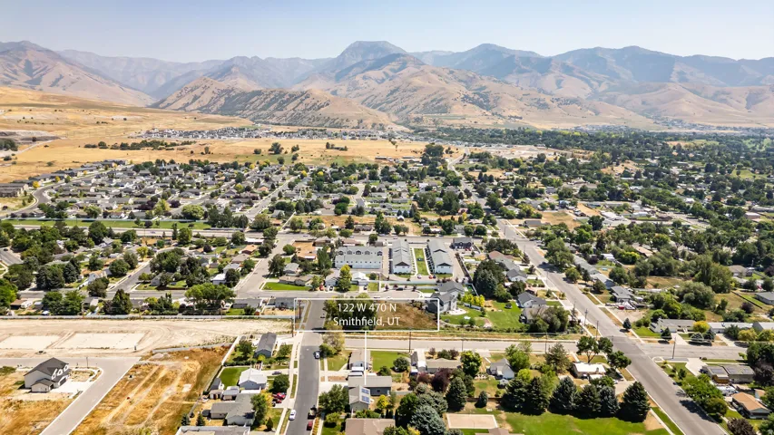 Expansive mountain backdrop with established residential areas