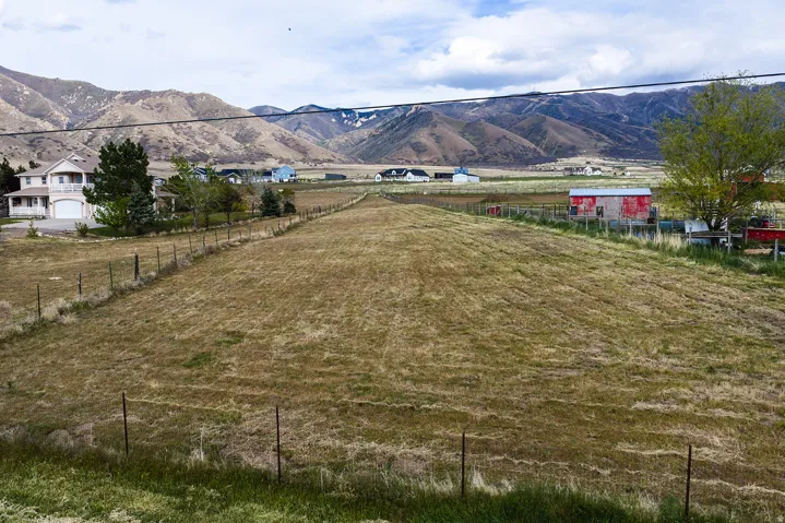 Expansive land parcel with surrounding mountain terrain