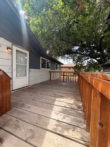 Wood deck with wooden railing