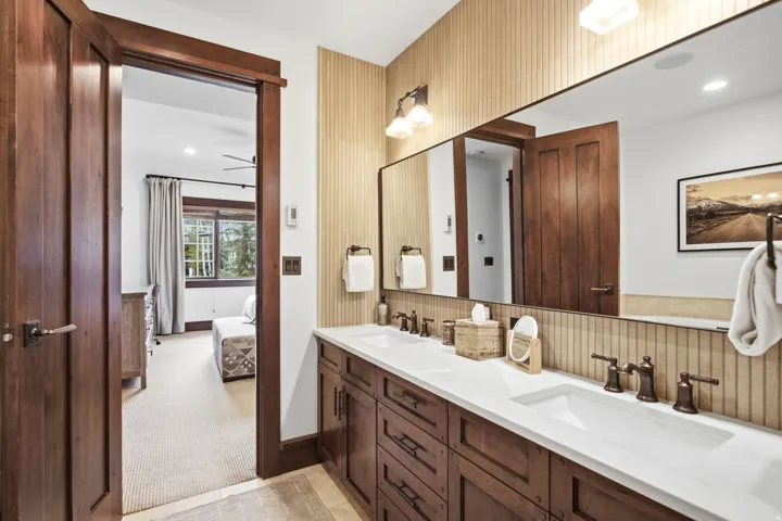 Dual vanity with integrated sinks and bronze-finish fixtures