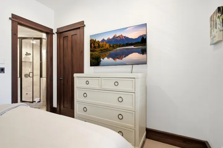 Dark wood-finish door frames with a solid wood panel door