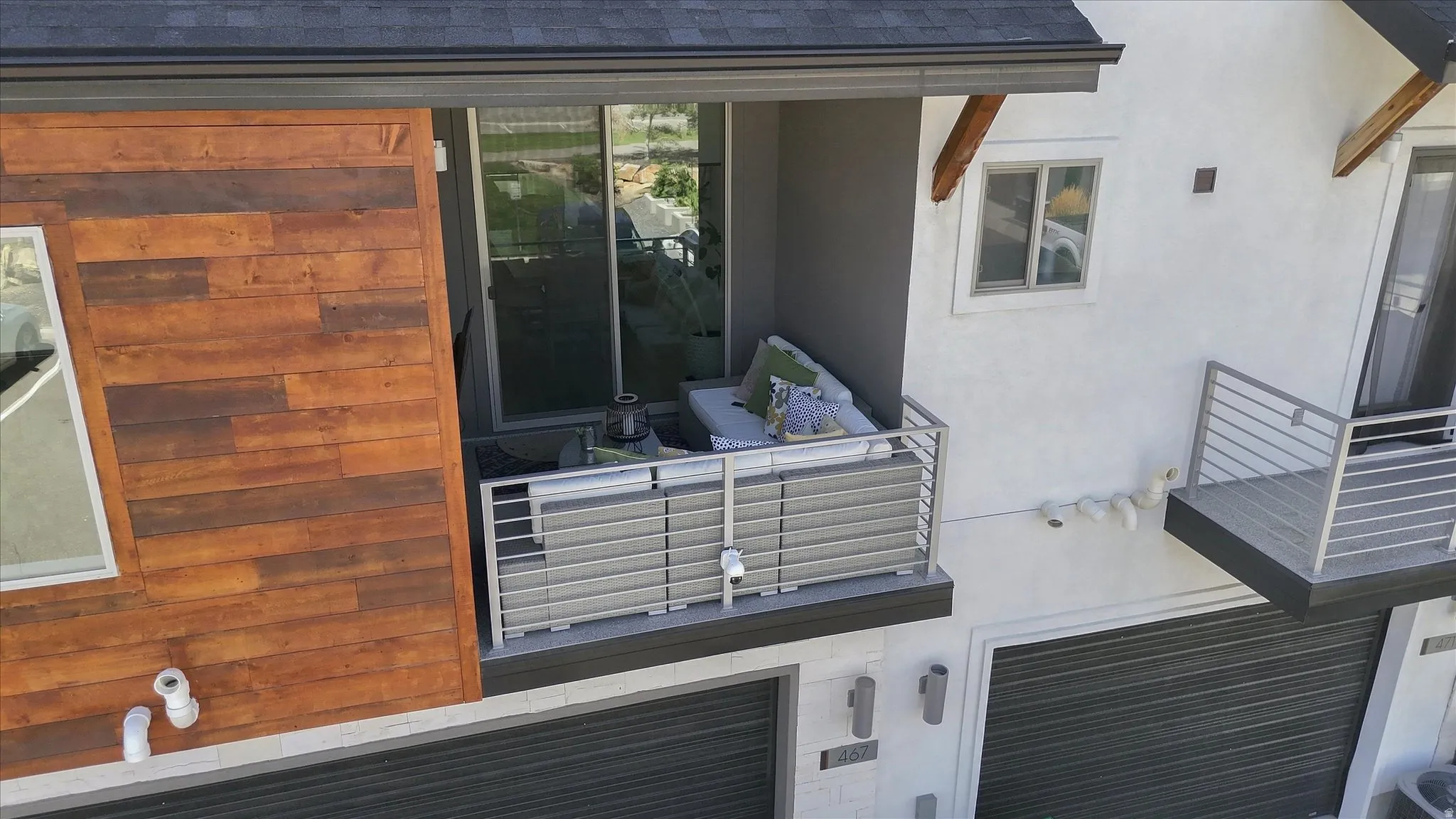 Private balcony featuring a sliding glass door and metal railing