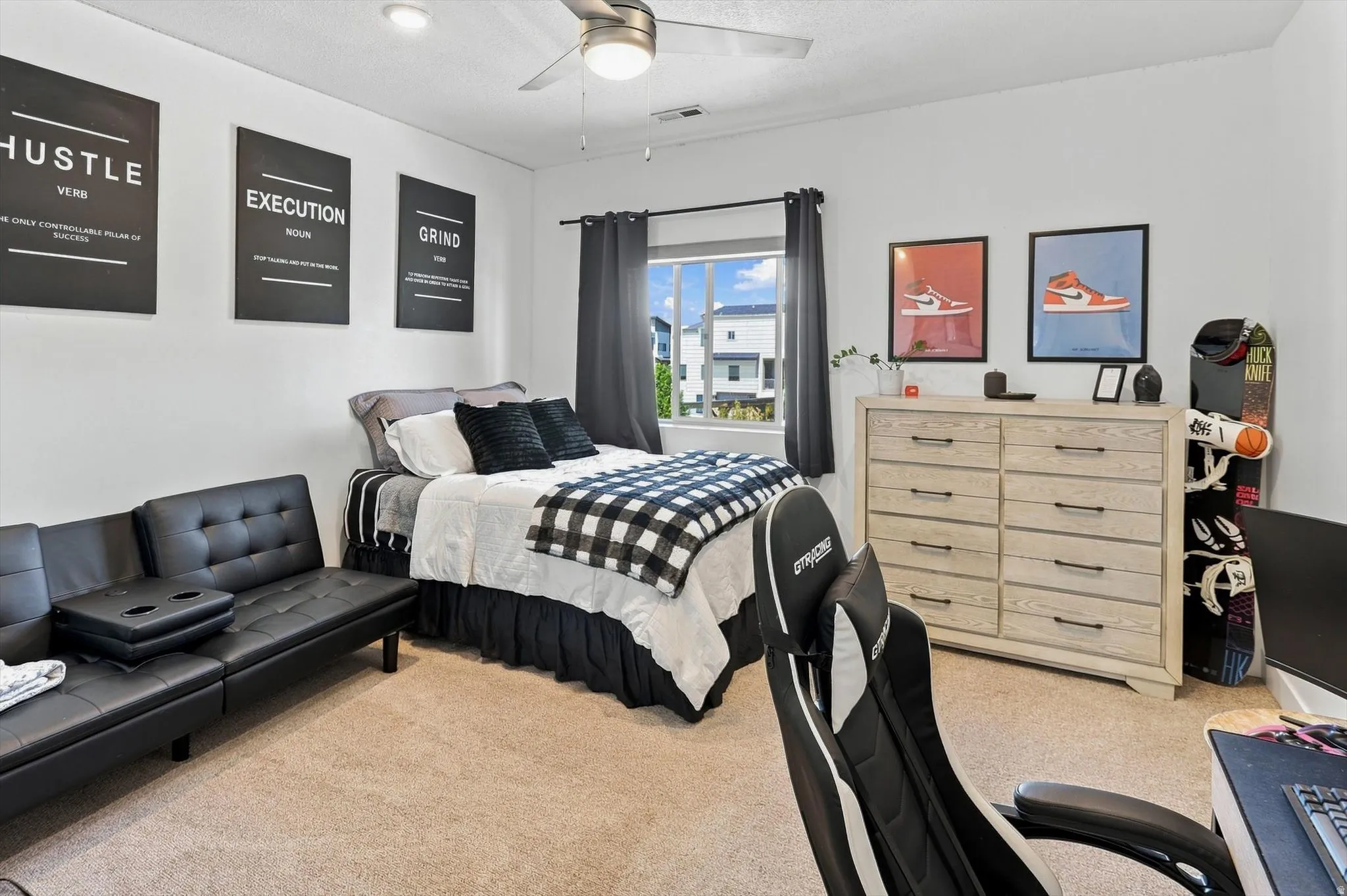Carpeted room featuring a ceiling fan, recessed lighting, and a window with dark curtains