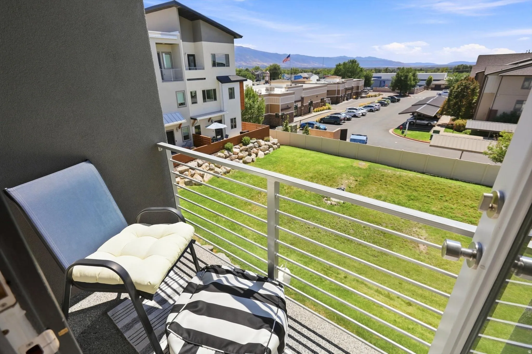 Balcony featuring a metal railing and a stucco exterior