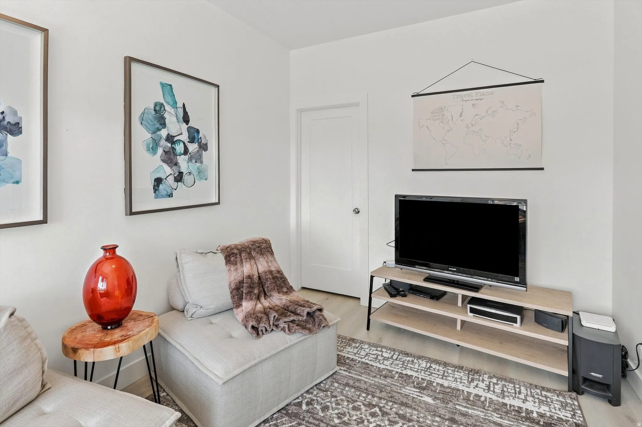 White walls with wood-finish flooring