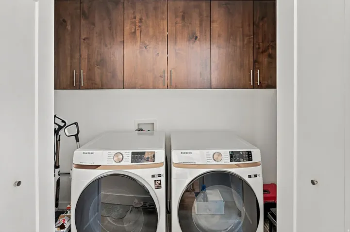 Built-in wood-finish cabinetry with modern hardware