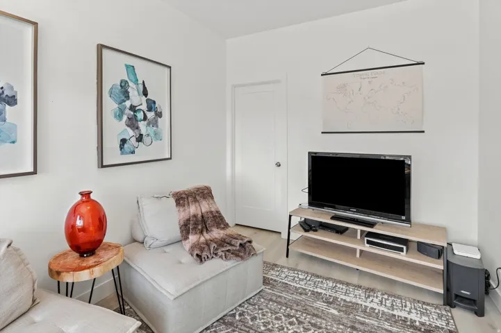 White walls with wood-finish flooring