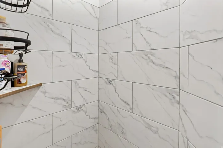 White rectangular wall tile with gray veining