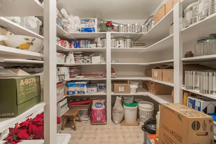 Extensive pantry storage featuring multiple levels of white shelving